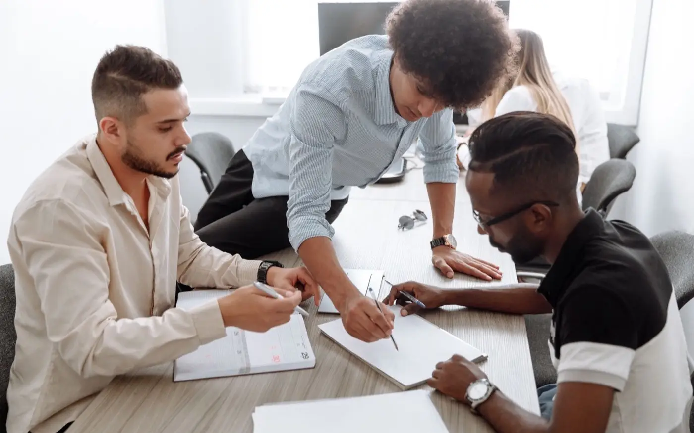 A team working through a plan on a table