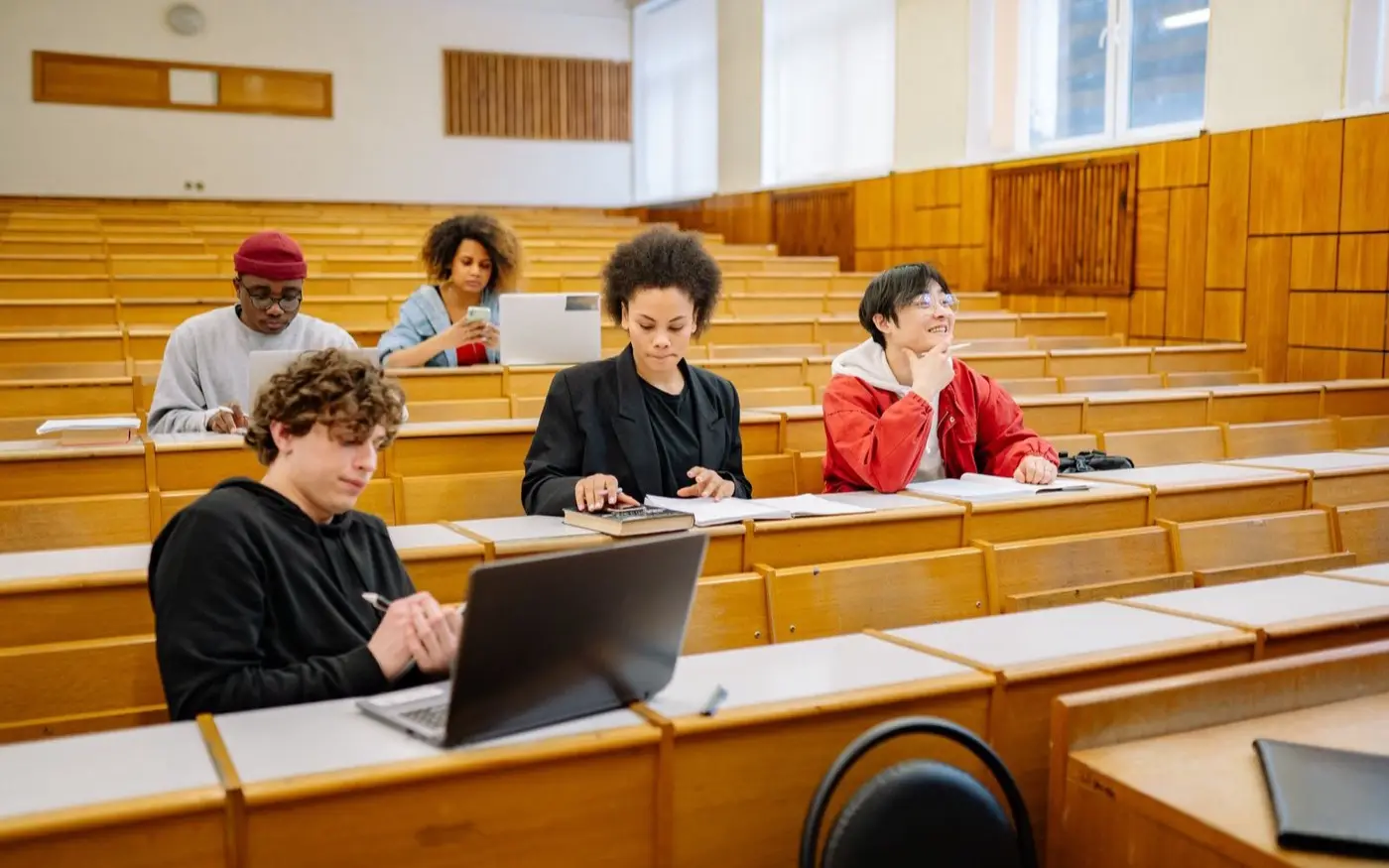 College students working together with laptops