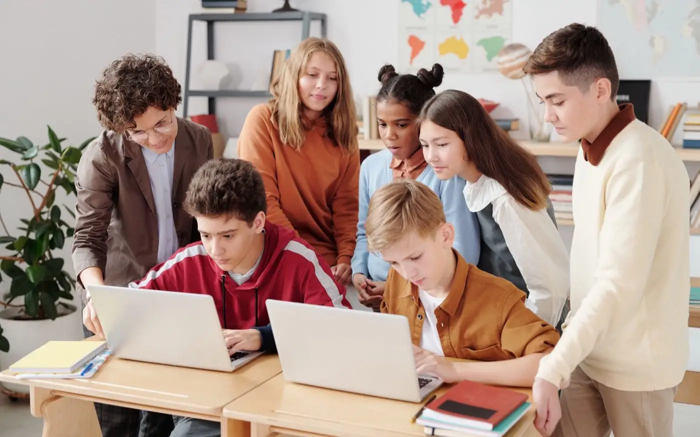 Students working on laptops in a classroom